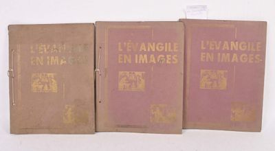 three old books are lined up on a white surface