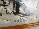 une photo d'un tableau sur le mur d'une salle de bain
