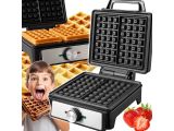 a close up of a child with a waffle maker and strawberries