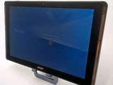 a tablet computer with a blue screen sitting on top of it