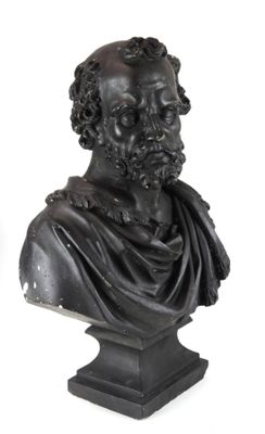 un buste d'homme barbu posé sur un socle