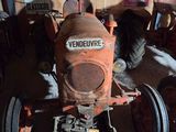 a tractor that is sitting in a garage