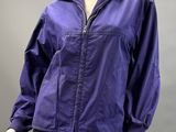 an image of a mannequin wearing a purple jacket and black skirt