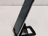 a cell phone that is sitting on a stand