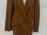 an image of a brown suit on a mannequin stand