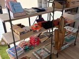 a book shelf with many books on it in a room