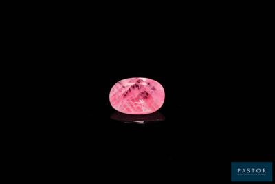 a close up of a pink moon in the dark sky