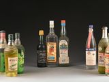 several bottles of alcohol are lined up in a row on a table