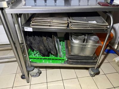 a metal cart with a bunch of pans on top of it
