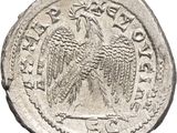 a close up of a coin with an eagle on it