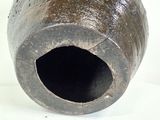 a vase that has a hole in the middle of it