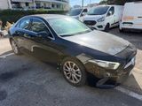 mercedes cla in black paint parked in a parking lot