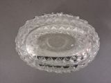 a clear glass bowl with a lid on a table