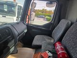 a view of the inside of a truck from the passenger seat
