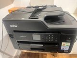 a printer that is sitting on top of a wooden table
