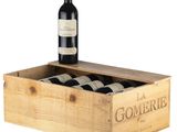 a wooden box with three bottles of wine in it