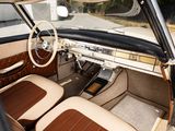 a car dashboard with a steering wheel and leather seats