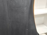 a close up of the back of a black leather jacket