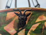 a close up of a bowl with a deer head on it
