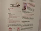 a poster on the wall of a building with information on it