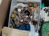 a box full of jewelry and other items in it