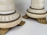 two candles that are sitting on top of each other