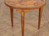 an image of a round table with a wooden top