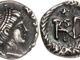 a silver coin with an image of a man on it