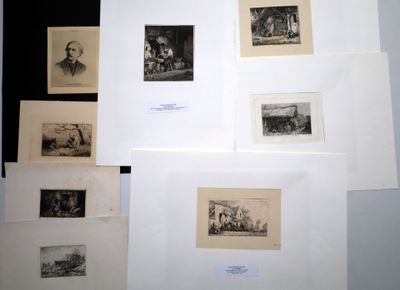 a lot of pictures on the wall of a room