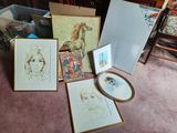 a lot of art on the floor in this room