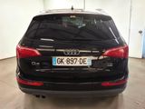 the back of a black audi suv parked in a garage