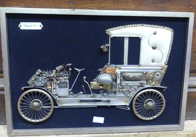 a picture of an old model car in a shadow box