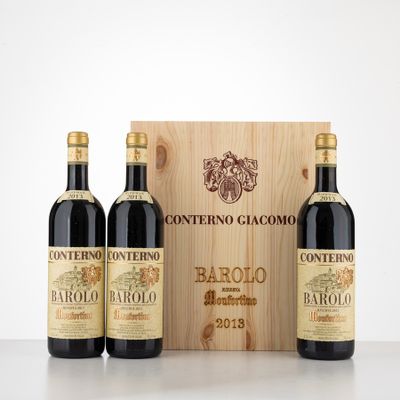 three bottles of wine in front of a wooden box