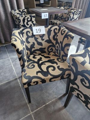 two chairs and a table with a price tag on it