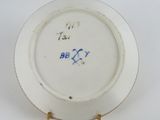 an image of a white plate with blue writing on it