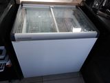 a white refrigerator with a glass door in a kitchen