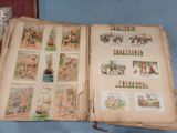an open book with pictures of people and animals on it