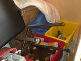 a pile of clutter in a room with a chair and other items