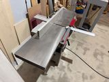 a picture of a table saw in a workshop