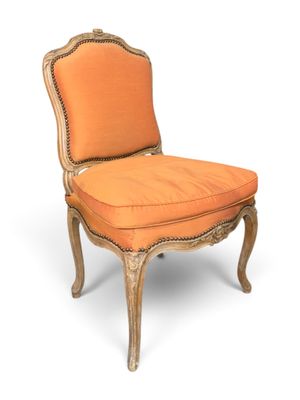 an image of a chair with an orange upholstered seat