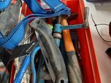 many tools in a red container on a table
