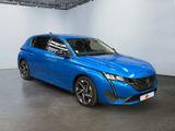 the blue car is parked in a large room with white walls