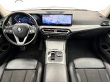 the interior of a bmw vehicle with a touch screen and steering controls