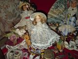 a table with a bunch of dolls on it