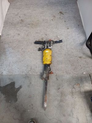 a yellow and black motorcycle that is laying on the floor