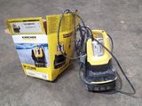 a yellow machine that is sitting next to a box