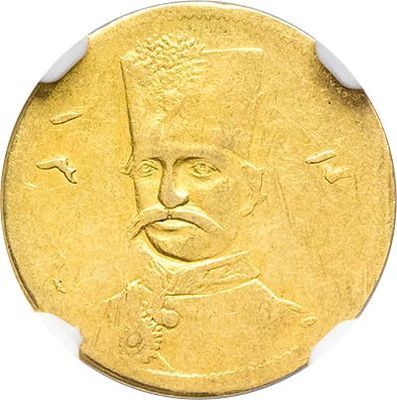 a close up of a gold coin with a man ' s face on it