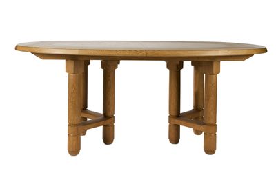 a wooden table with four legs and a round top