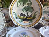 a lot of plates that are sitting on a table