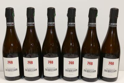 six bottles of wine are lined up on a table